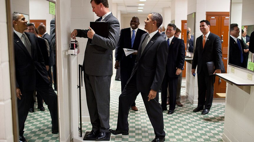 President Barack Obama jokes around with a director