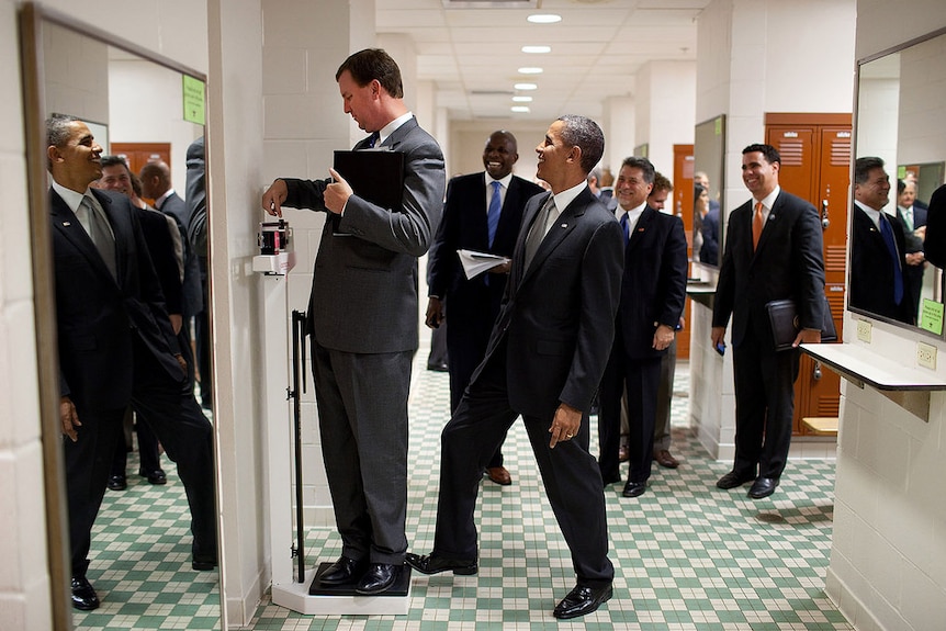 President Barack Obama jokes around with a director