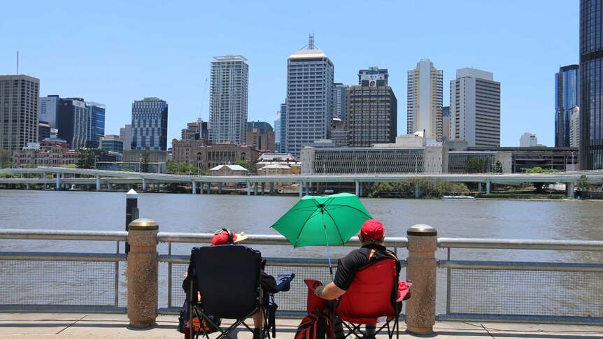 A couple out early by the Brisbane River in South Bank