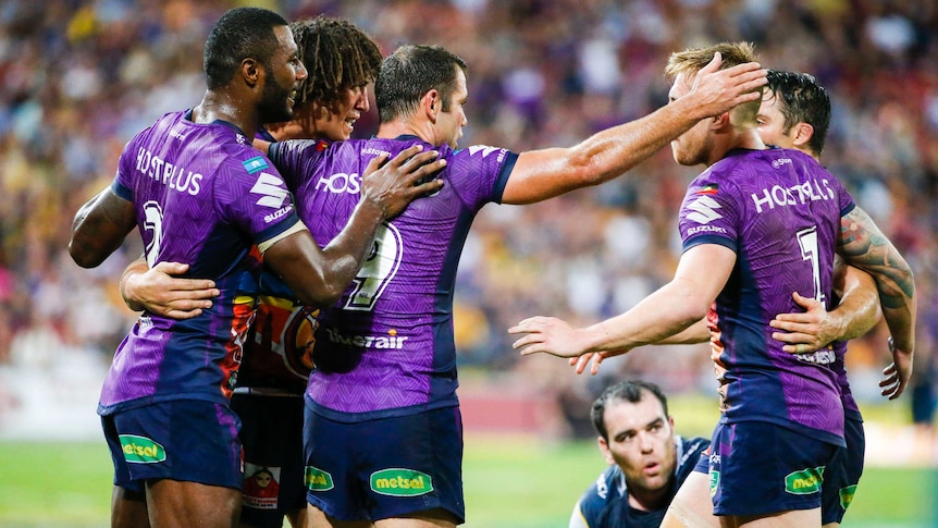 Melbourne Storm celebrate their win over North Queensland Cowboys