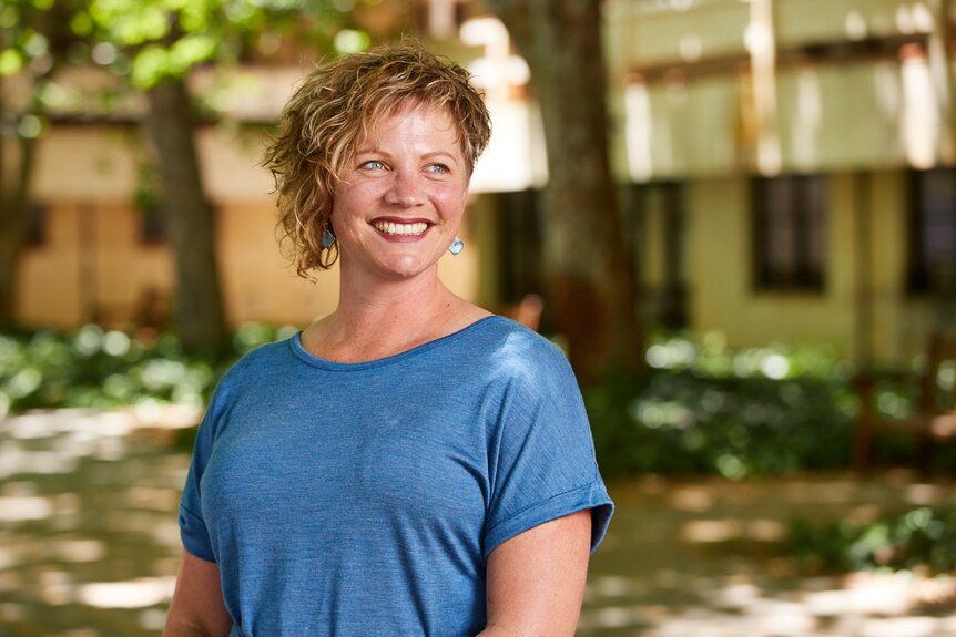 A picture of Dr Katie Attwell smiling wearing a blue top.