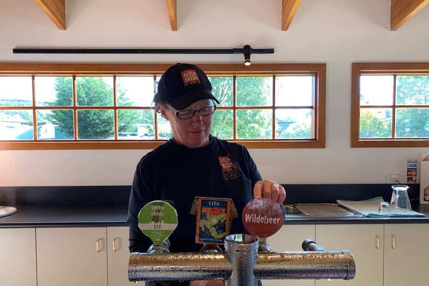 Beer being poured in brewery.