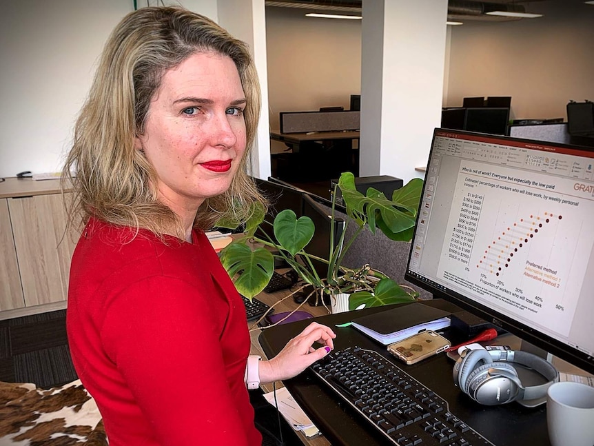 The Grattan Institute's Danielle Wood sits at her computer with a graph on the screen.