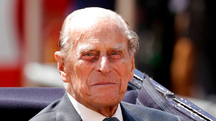Prince Philip, the husband of Queen Elizabeth II, sits in a carriage in London