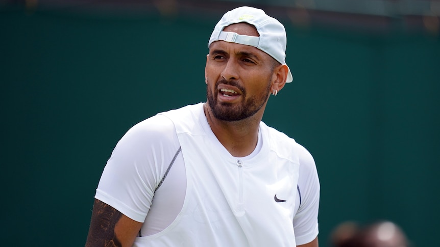 Nick Kyrgios looks off to one side