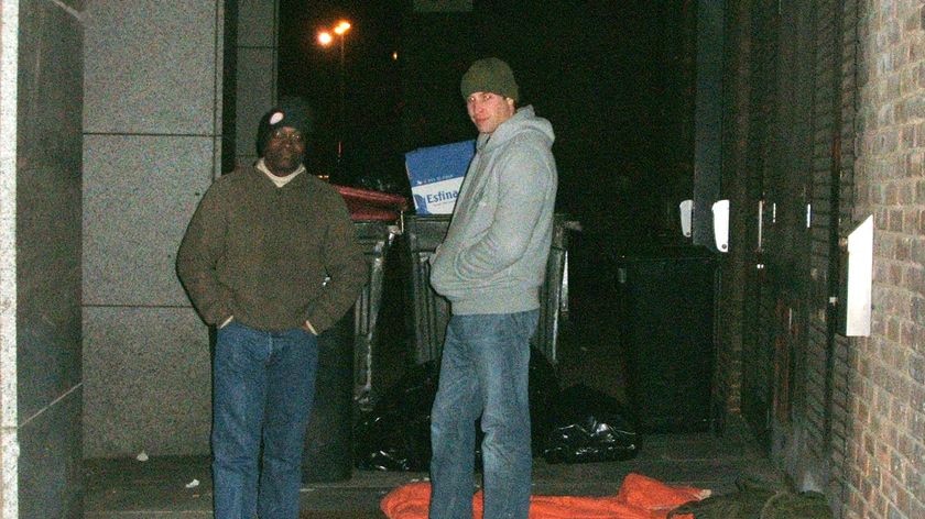 Britain's Prince William (R) and Seyi Obakin, CEO for the Centrepoint charity for homeless people