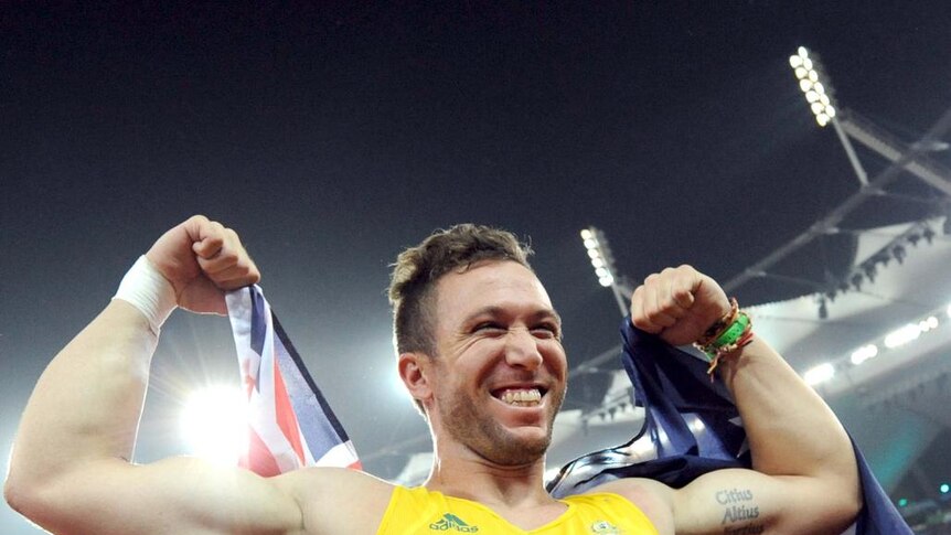 Newcastle's Benn Harradine celebrates his gold medal in the men's discus at the Commonwealth Games in 2010.
