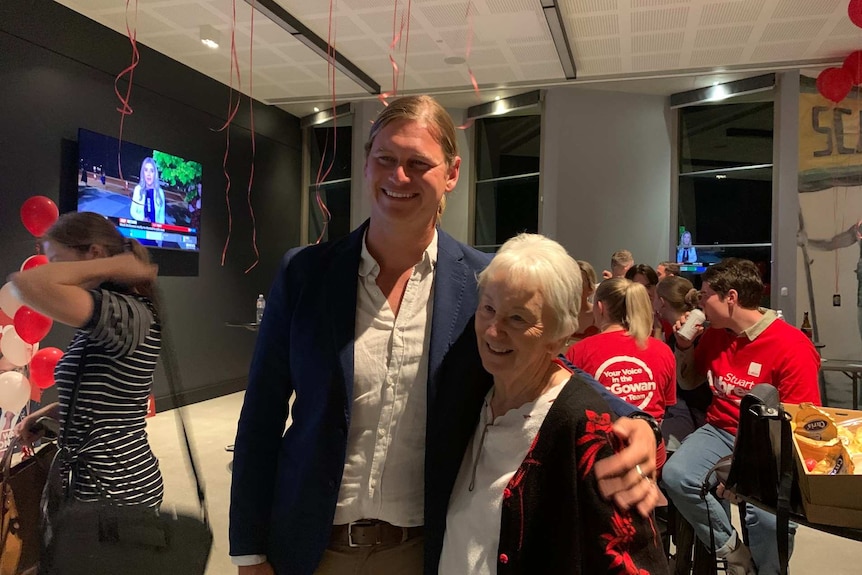 Labor's Stuart Aubrey hugs a supporter after claiming victory in Scarborough in 2021 WA election on March 13.