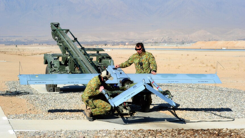 Australian aircraft technicians prepare a Shadow UAV for take off in Afghanistan.