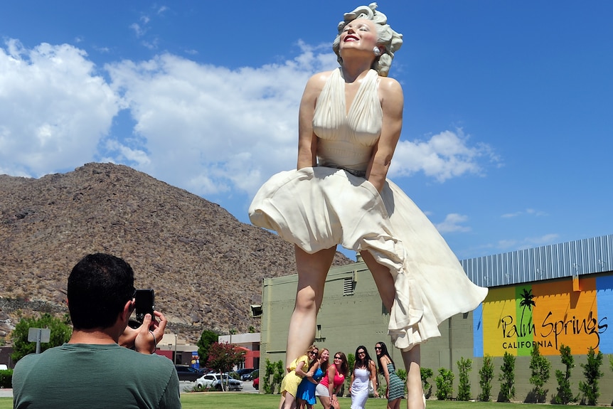 Fans pose with giant Marilyn