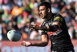 Tyrone May of the Penrith Panthers passes a ball.