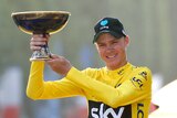 Yellow jersey leader and overall winner Team Sky rider Chris Froome of Britain reacts on the podium.