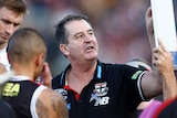 Ross Lyon points to a board during a break in an AFL match between St Kilda and Hawthorn.
