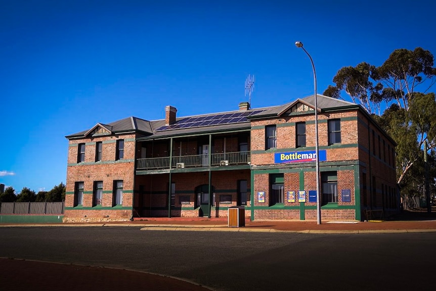 An old, double-storey, red brick pub in regional Australia.