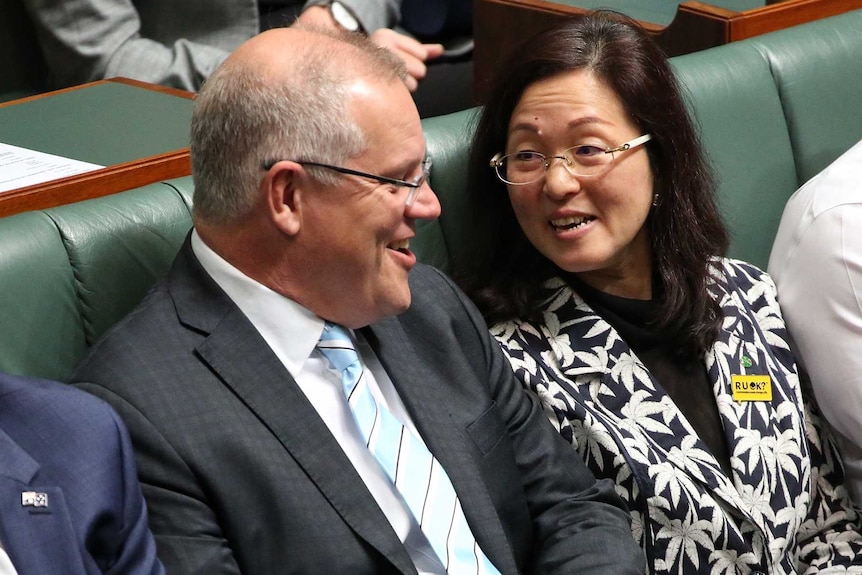 Mr Morrison and Ms Liu are in discussion, looking relaxed and smiling.