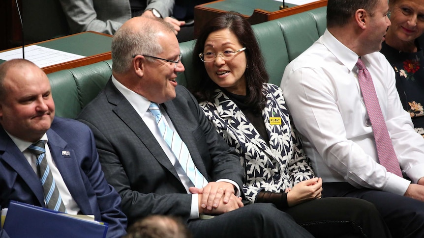 Mr Morrison and Ms Liu are in discussion, looking relaxed and smiling.