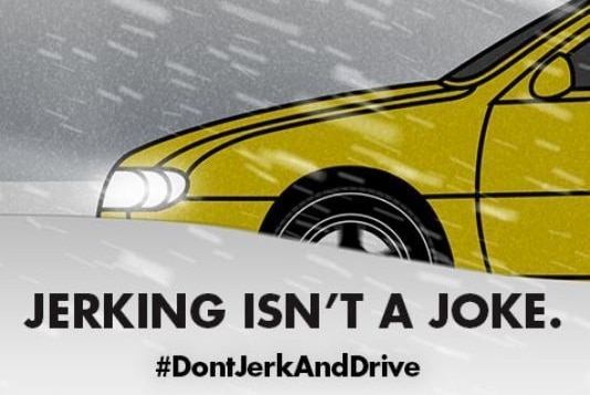 An ad saying 'jerking isn't a joke. Don't jerk and drive' with a picture of a car driving in ice