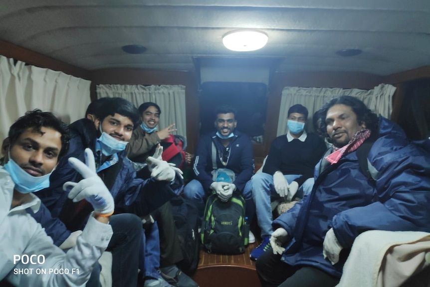 The Jag Anand crew smiles after getting off the ship. They are on a boat in Japanese waters.