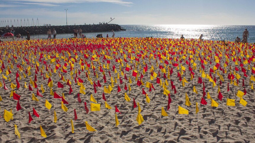red and yellow survey flags sculpture on Cottesloe Beach