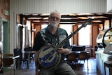 man holding a banjo