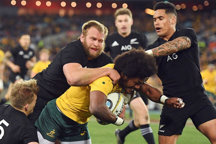 Wallabies' Henry Speight gang tackled by All Blacks in Sydney at the Bledisloe Cup.