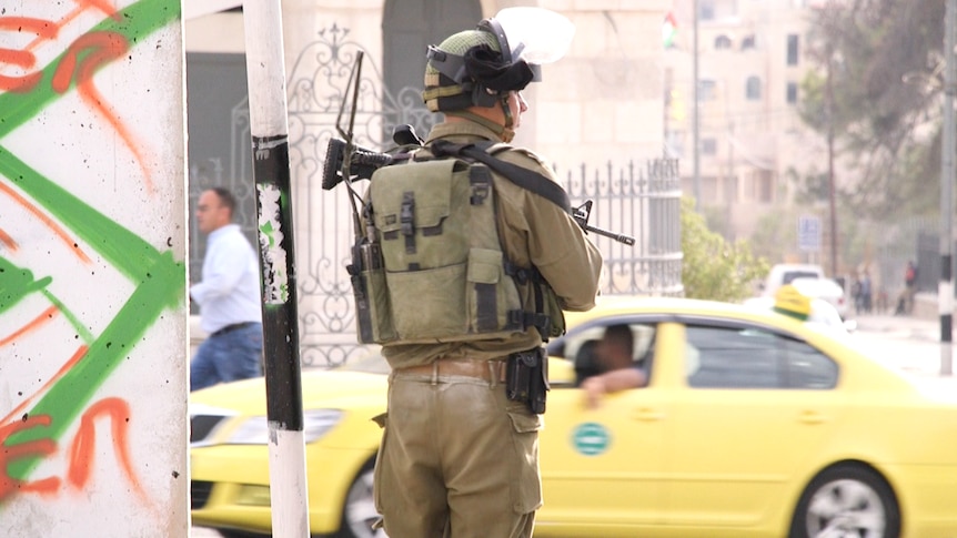 An Israeli soldier patrols in the occupied West Bank town of Bethlehem on Friday.