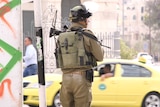 An Israeli soldier patrols in the occupied West Bank town of Bethlehem on Friday.
