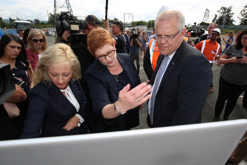 Melissa McIntosh, Marise Payne and Scott Morrison look at construction plans