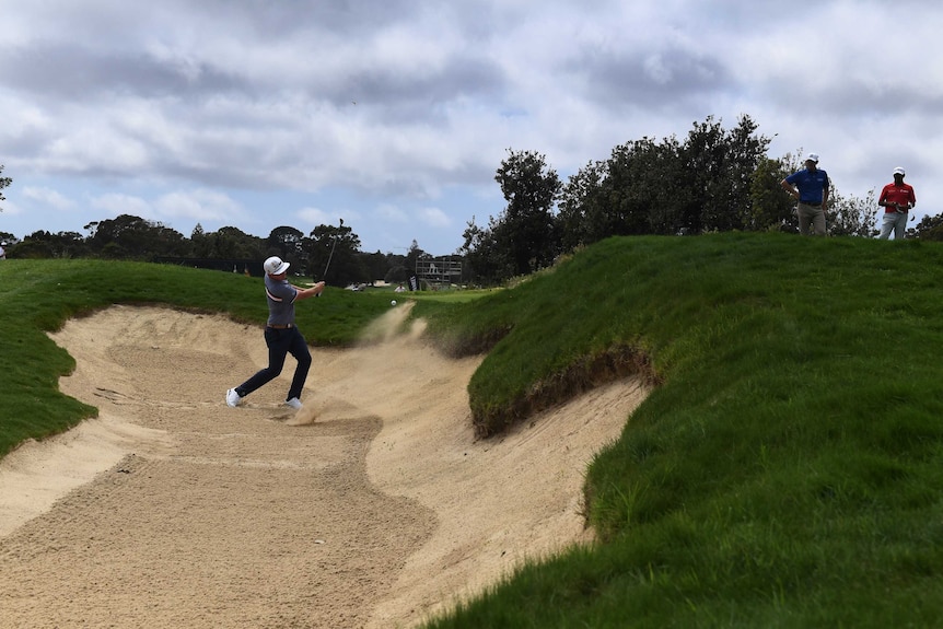 Cameron Smith plays from the bunker at the Australian Open