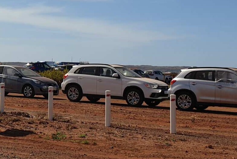 Pictures is dozens upon dozens of damaged vehicles near the Karratha Airport.