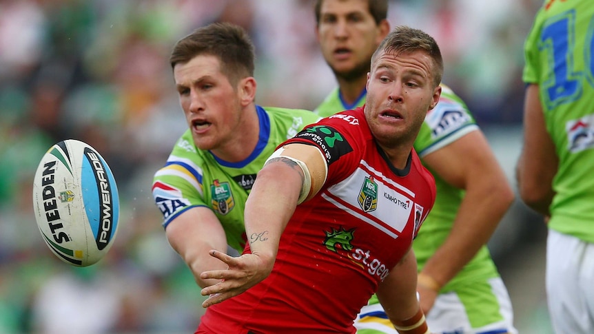 The Dragons' Trent Merrin offloads the ball against Canberra at Canberra Stadium on March 21, 2015.