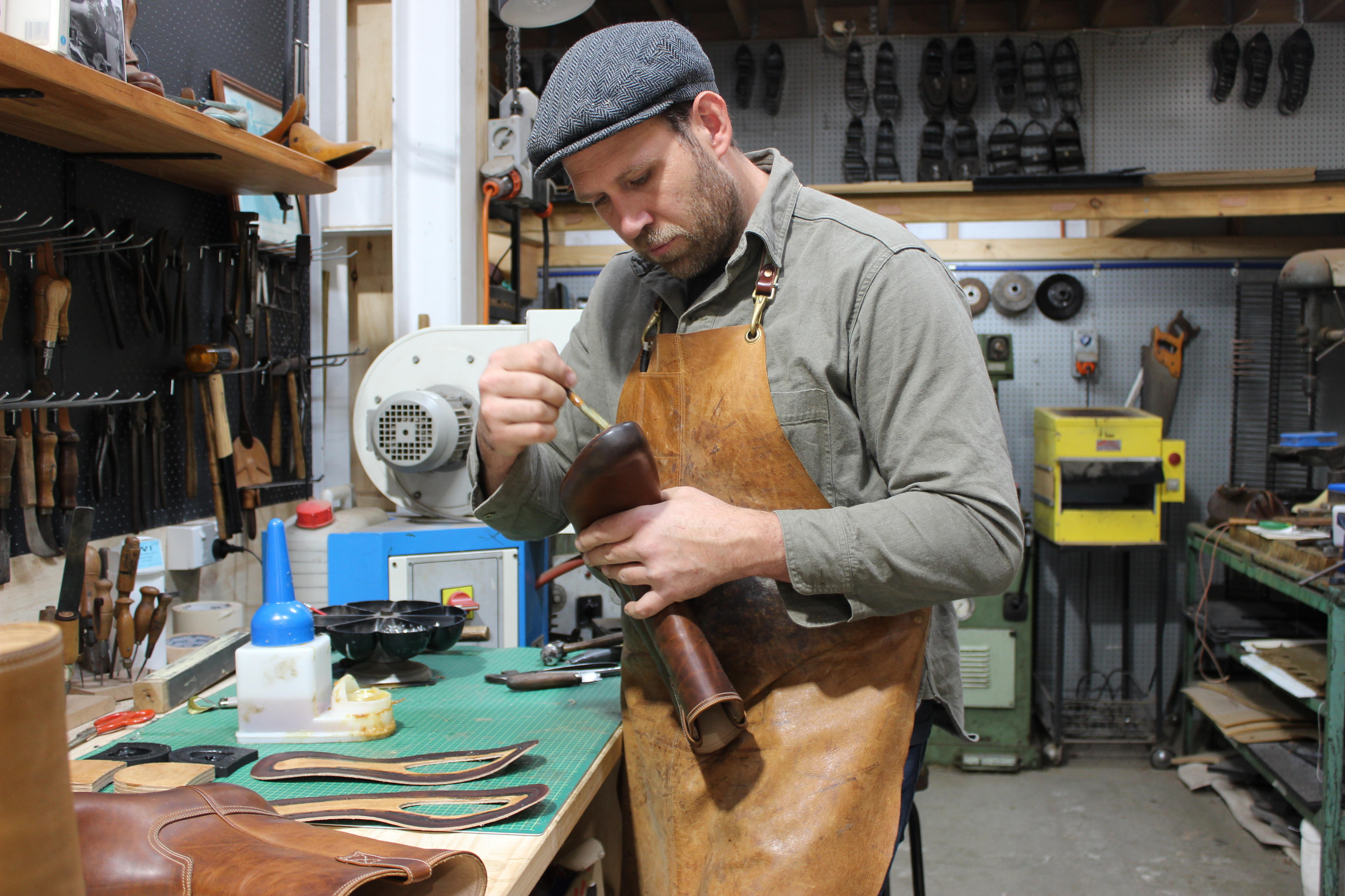 Jess Wootten works on a shoe at his Wootten shop.