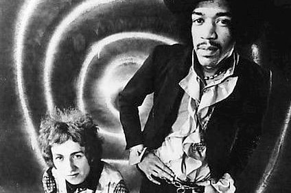 The Jimi Hendrix Experience - three band members pose in black and white photo