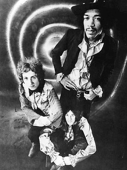 The Jimi Hendrix Experience - three band members pose in black and white photo