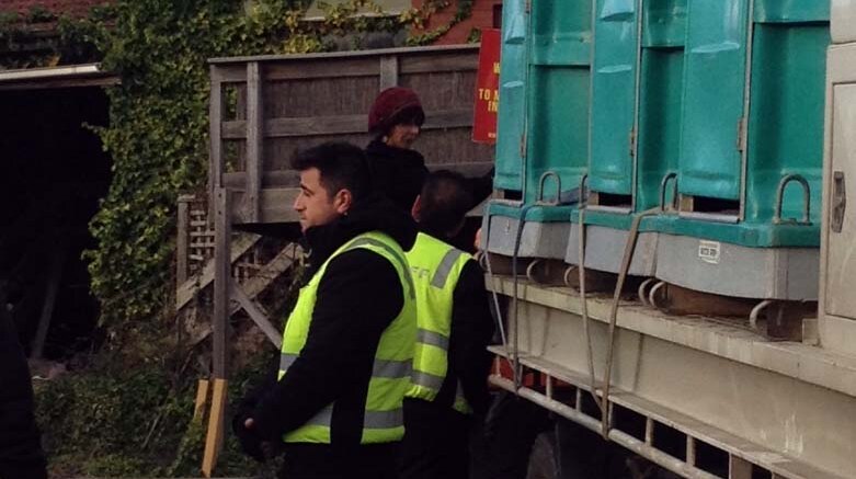 Protester holding truck and refusing to let go at McDonalds protest at Tecoma