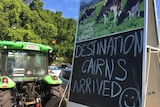 Tractor and trailer of Greg Dennis with writing announcing arrival into Cairns