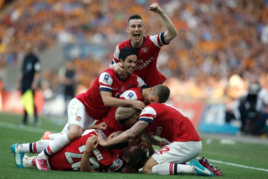 Arsenal players celebrate FA Cup-winning goal