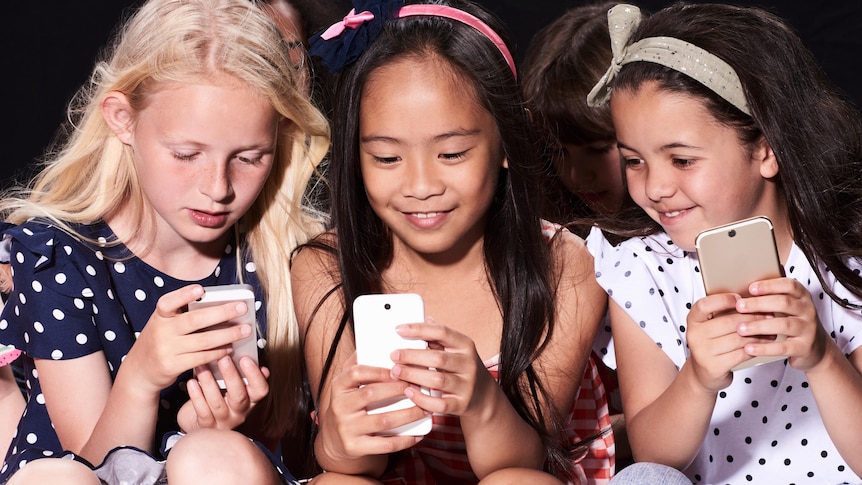 Group of friends using their phones