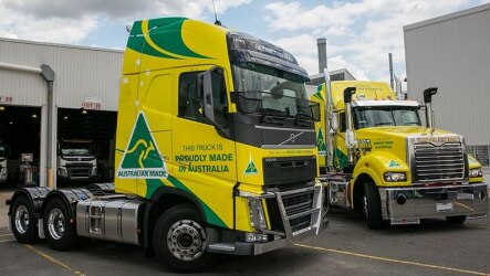 Two prime movers painted in 'Proudly Made in Australia' livery.