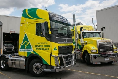 Two prime movers painted in 'Proudly Made in Australia' livery.