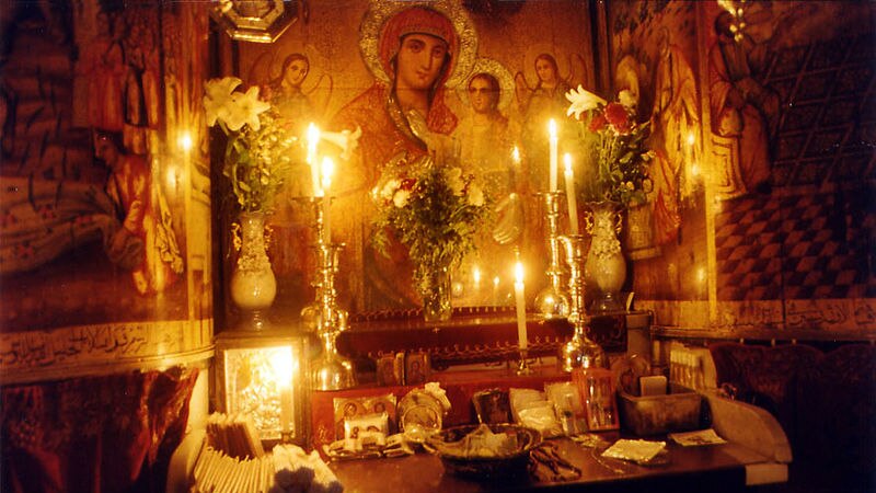 A photo of a candlelit Coptic altar.