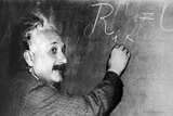 An undated photo of physicist Albert Einstein with blackboard