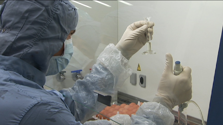 A scientist with the Q Fever vaccine.