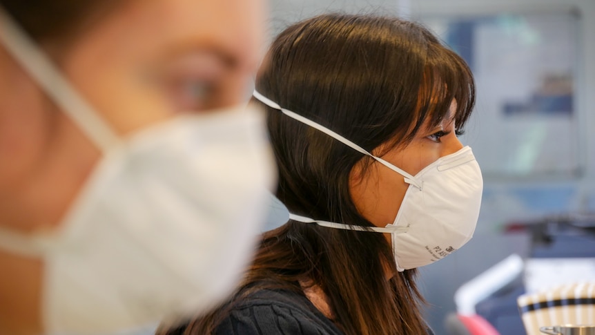 face mask being worn in office generic