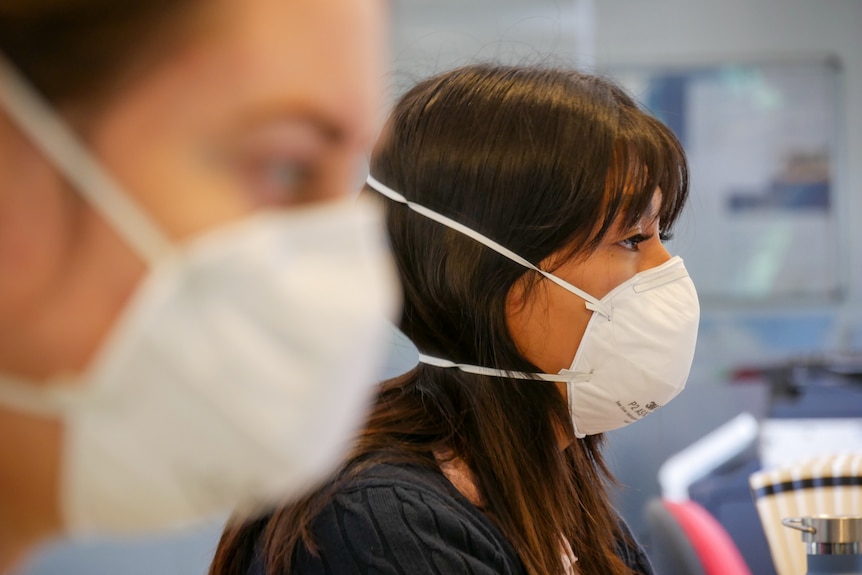 face mask being worn in office generic