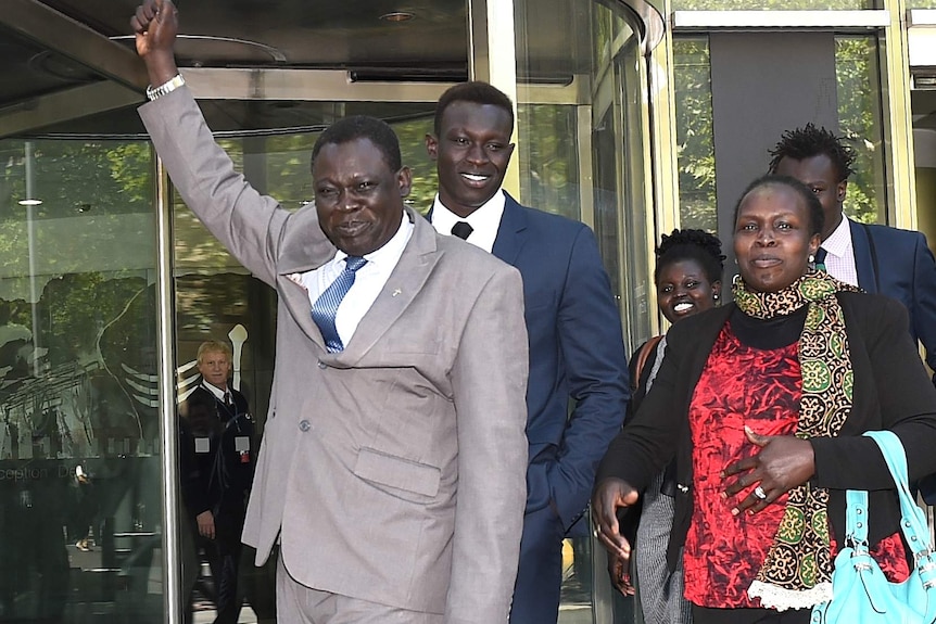 Majak Daw (c) with his family and supporters after his not guilty verdict.