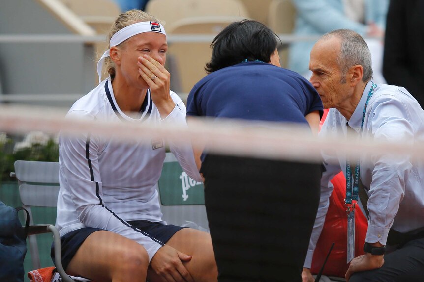 Kiki Bertens cries with her hand over her mouth