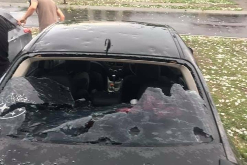 Hail smashes car and its windscreen in storm at Rosewood, west of Brisbane.