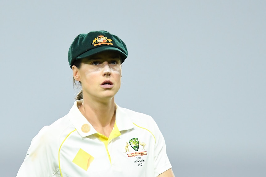 Ellyse Perry looks into the distance while wearing Australian test match gear