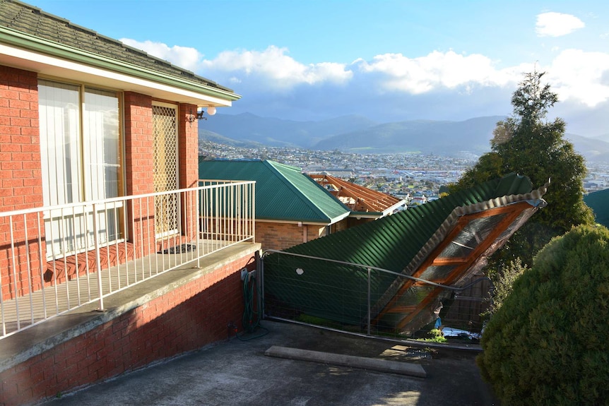 A roof has been ripped off a home in the Hobart suburb of Lutana in high winds